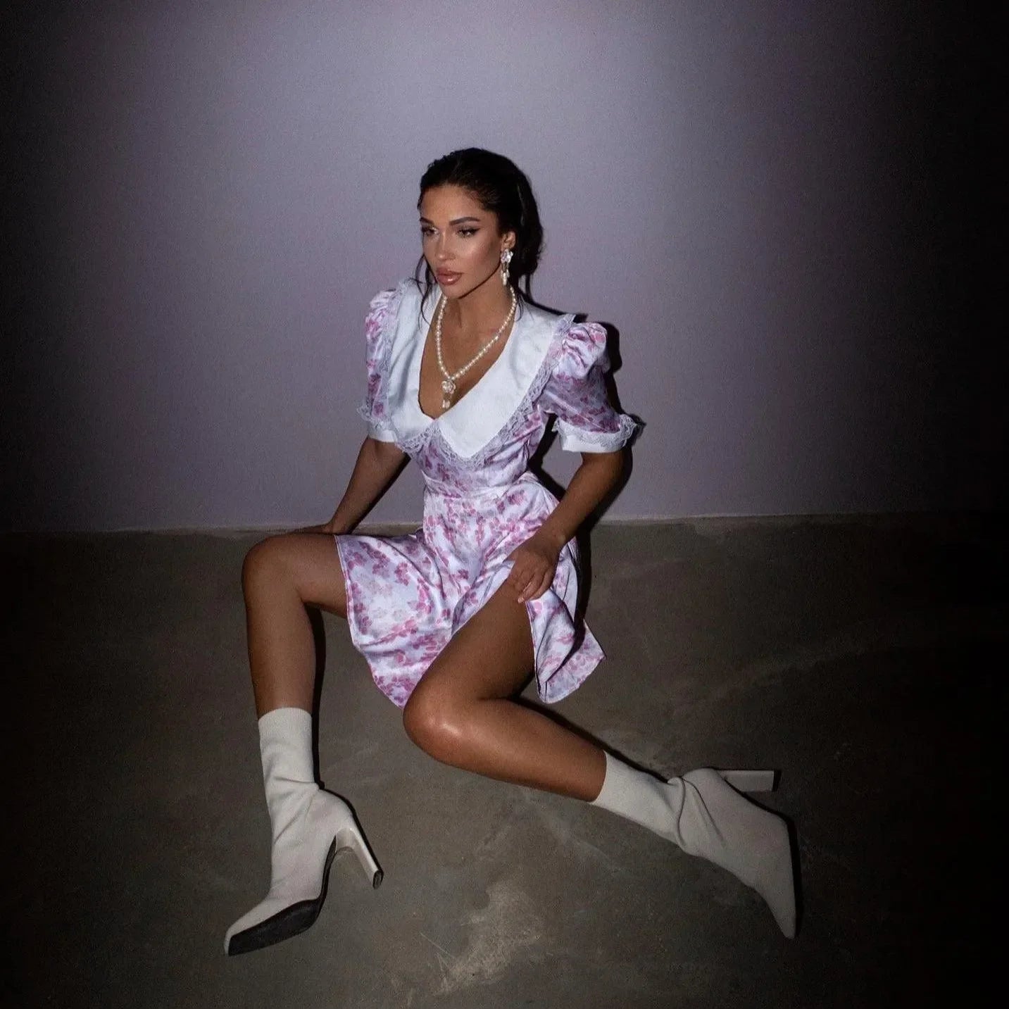 floral mini dress with large collar and puff sleeves, paired with white ankle boots