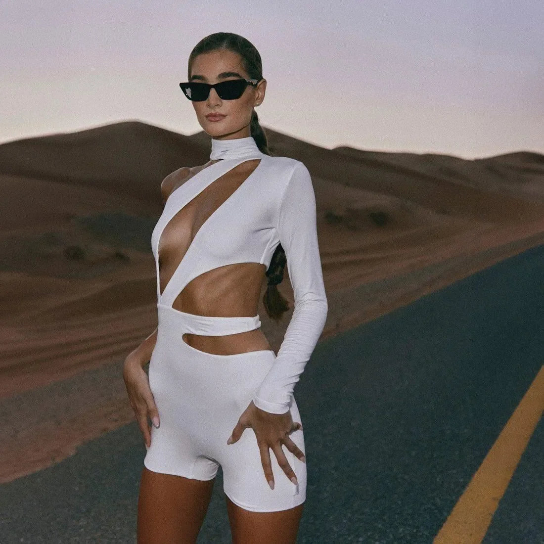 white cut-out bodysuit with asymmetrical design, evening look