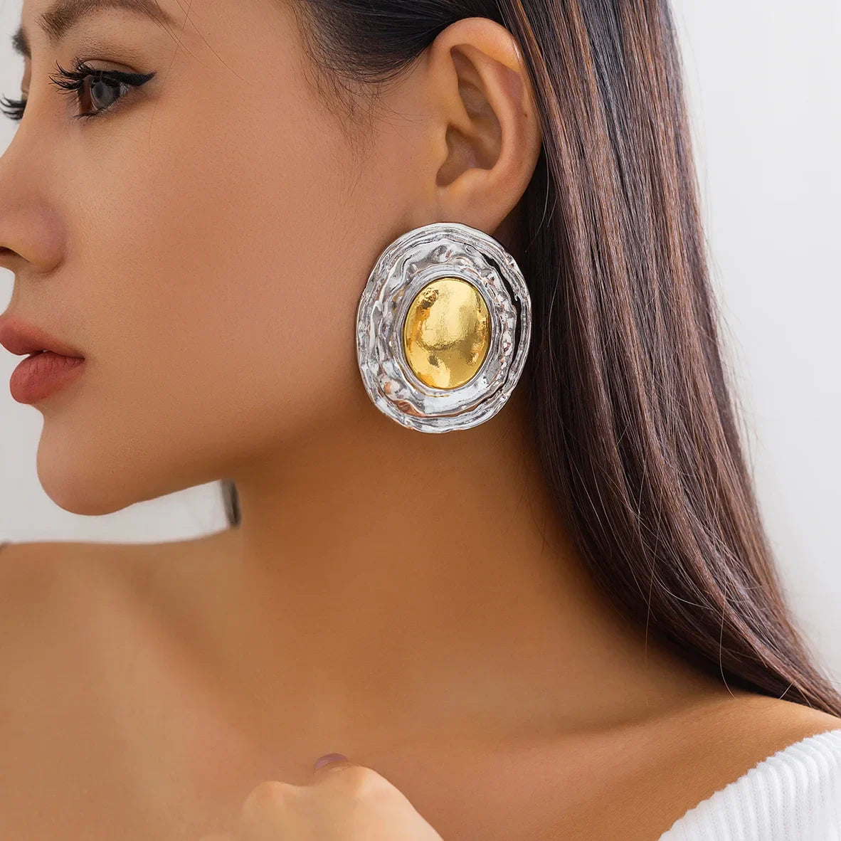 statement gold and silver-tone hoop earrings