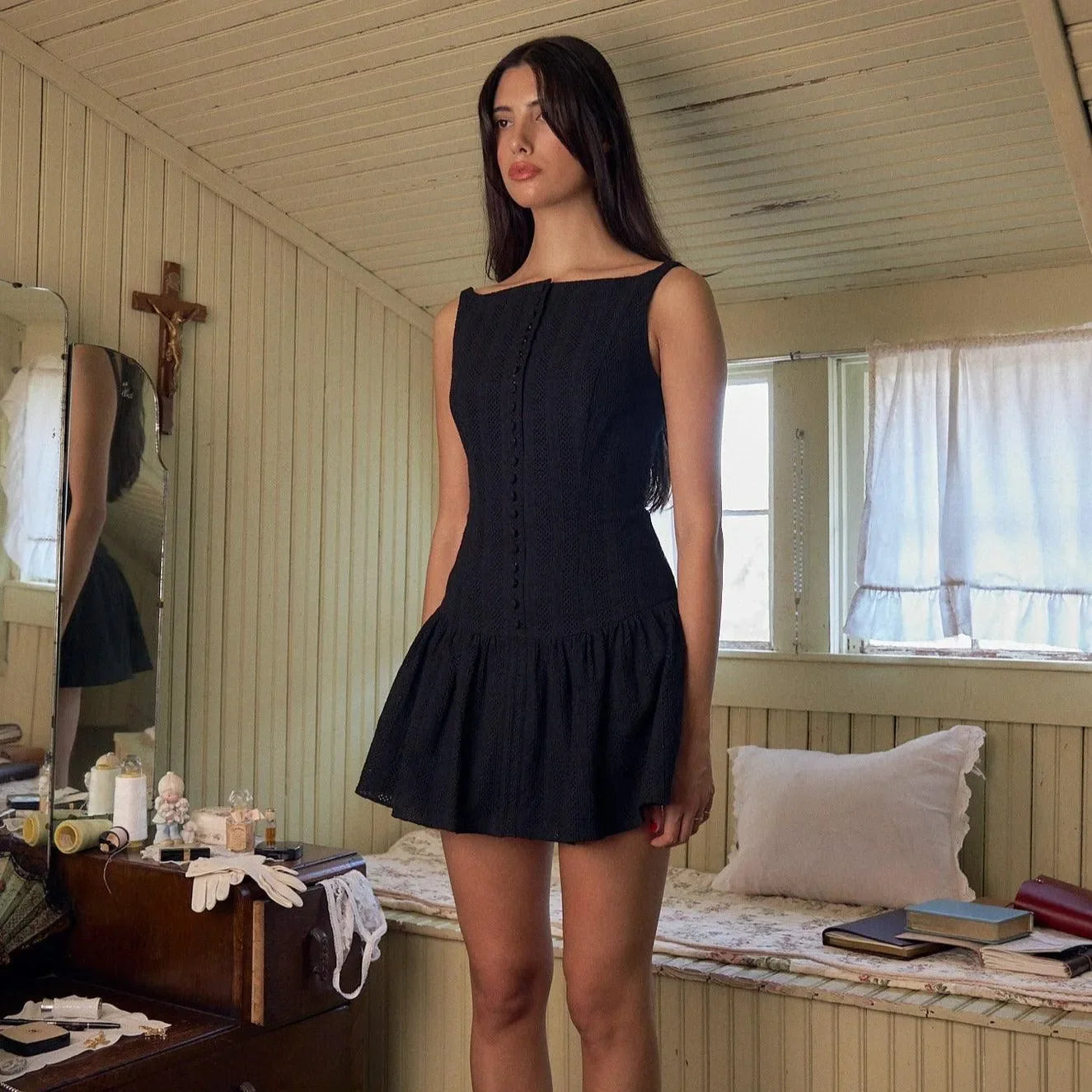 black mini dress with button detail and flared skirt, casual style