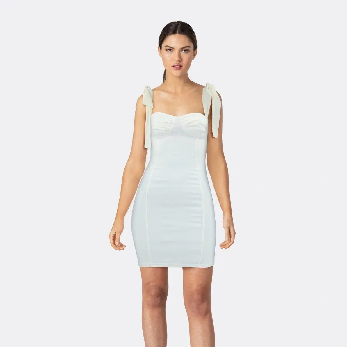 white bodycon mini dress with bow shoulder straps, evening look