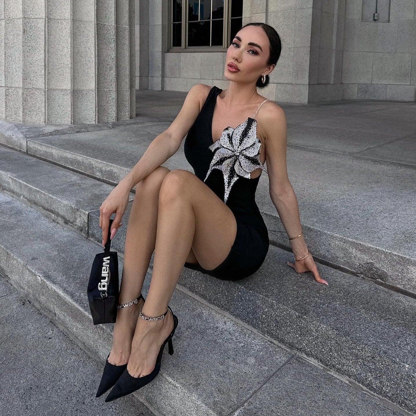 One-shoulder mini dress with sequin floral detail.