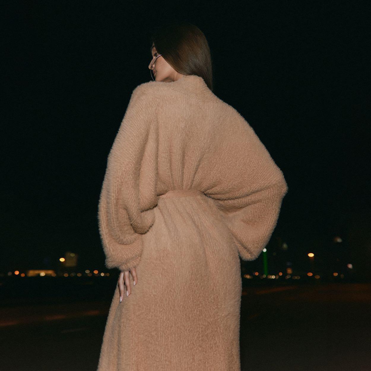 Oversized khaki long sleeve cardigan with a cozy, relaxed fit, styled belted at the waist for added shape.