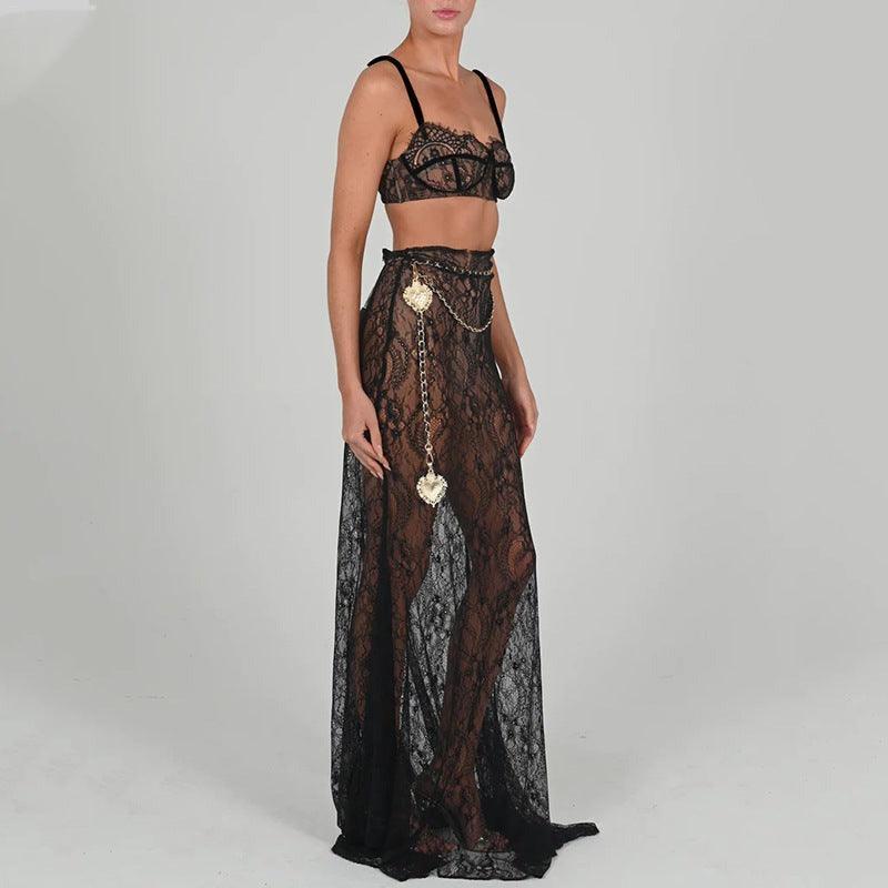 Black lace maxi skirt set featuring a cropped lace bralette, styled with a chain accessory for an elegant look.