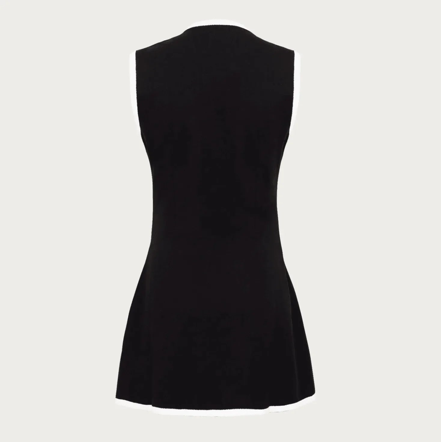 Black sleeveless knit mini dress.
