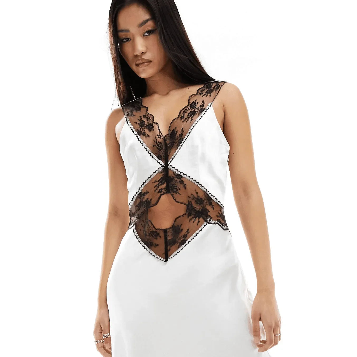 White and black lace dress with cut-out details.