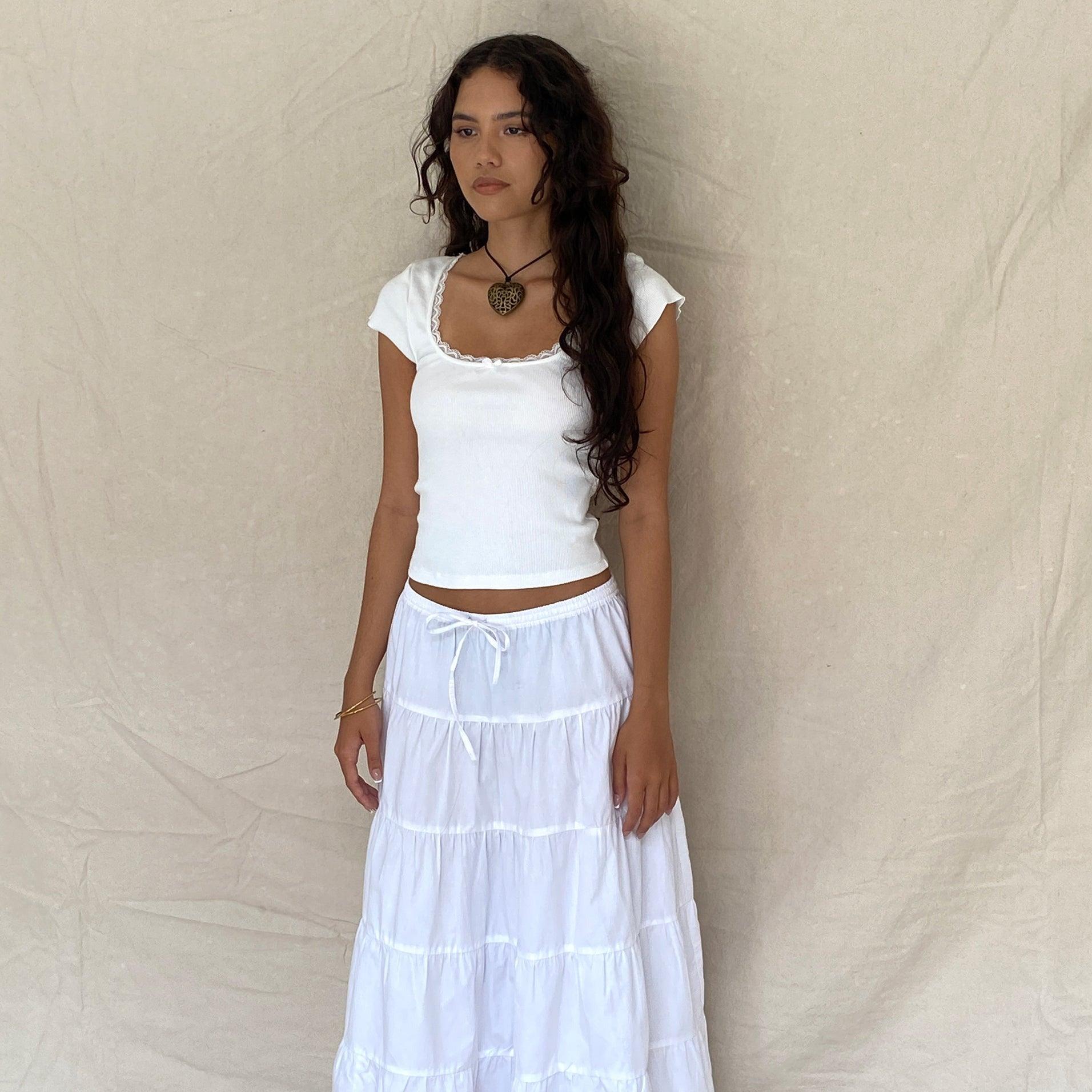 white crop top with ruffled neckline and tiered maxi skirt, casual chic look