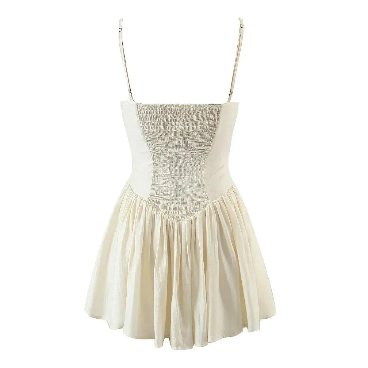 Cream mini dress with a smocked bodice and flowing skirt, perfect for casual summer outings or beach vacations.