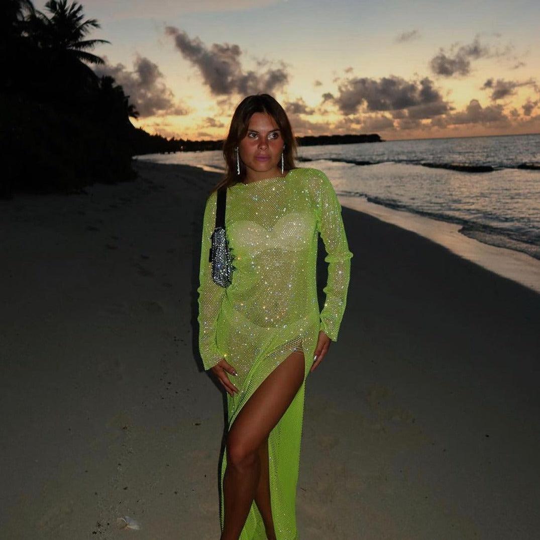 Light green rhinestone midi dress with long sleeves, featuring a high slit and form-fitting silhouette, styled for a...