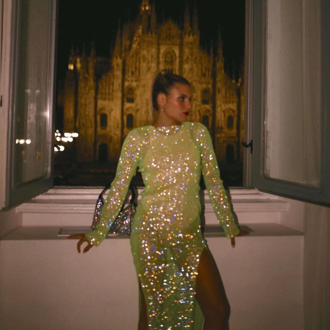Light green midi dress with rhinestones, fitted silhouette, featuring a thigh-high slit, styled elegantly for evening wear.