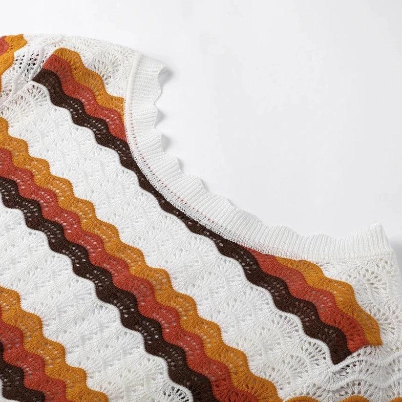 Multicolor zigzag knit top with scalloped edges.