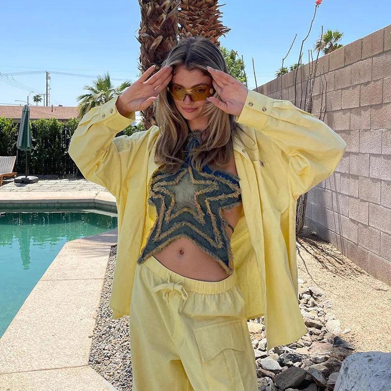 frayed star-patterned crop top with yellow oversized shirt and pants, casual summer look