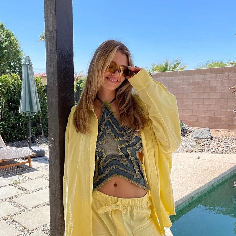 frayed denim star-pattern top with yellow oversized shirt and shorts, casual summer style