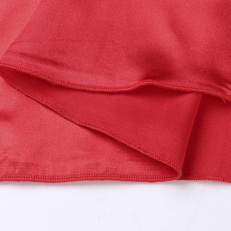 Red satin fabric close-up.