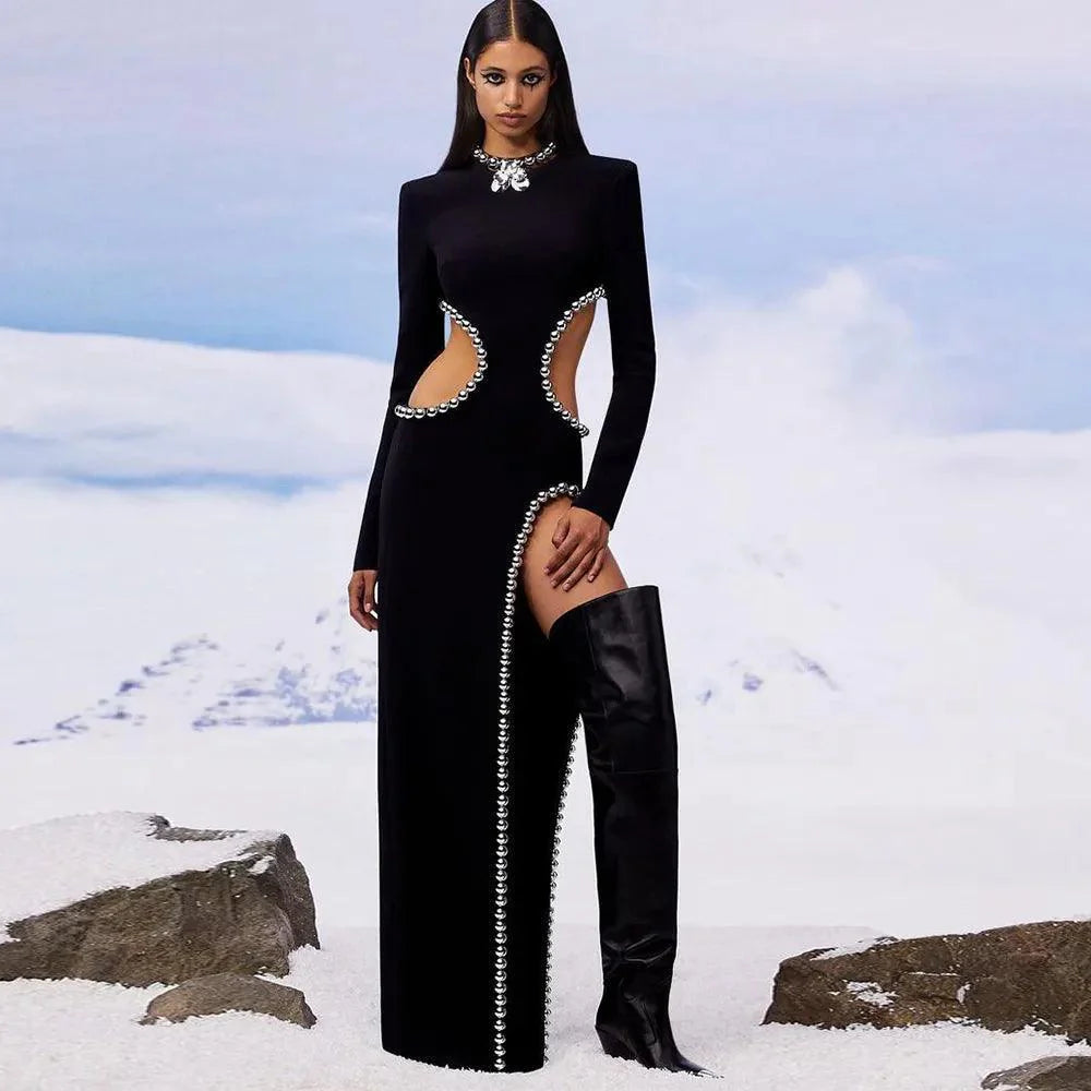 black long-sleeve gown with side cutouts and pearl detailing, evening wear