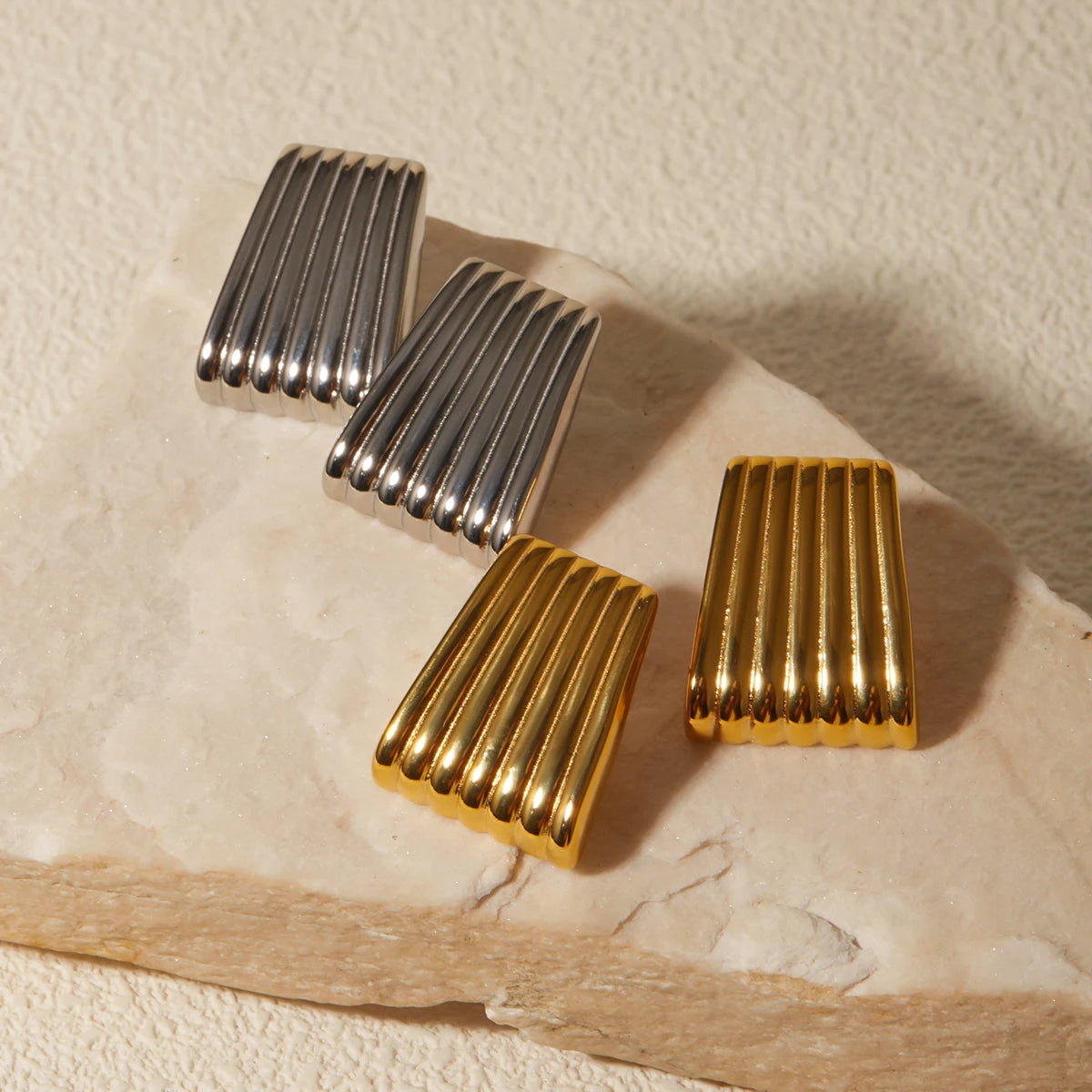 ribbed metallic clip-on earrings, silver and gold tones