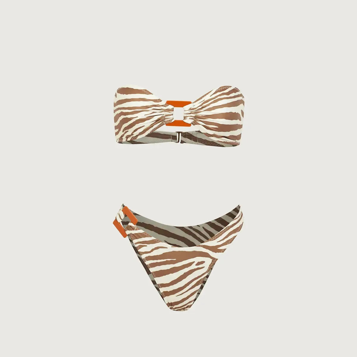 Strapless zebra print bikini in tan and brown, featuring a bow detail and stylish high-cut bottoms for a flattering fit.