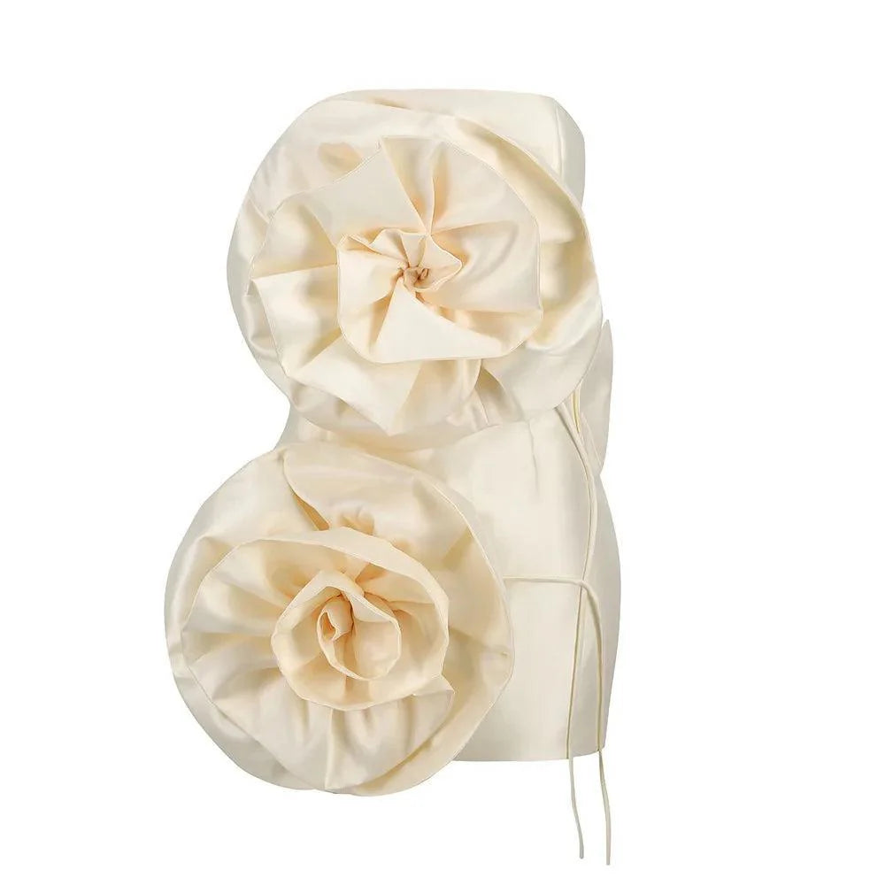 Cream silk mini dress featuring voluminous flower appliqués, styled with a fitted corset silhouette for a chic look.