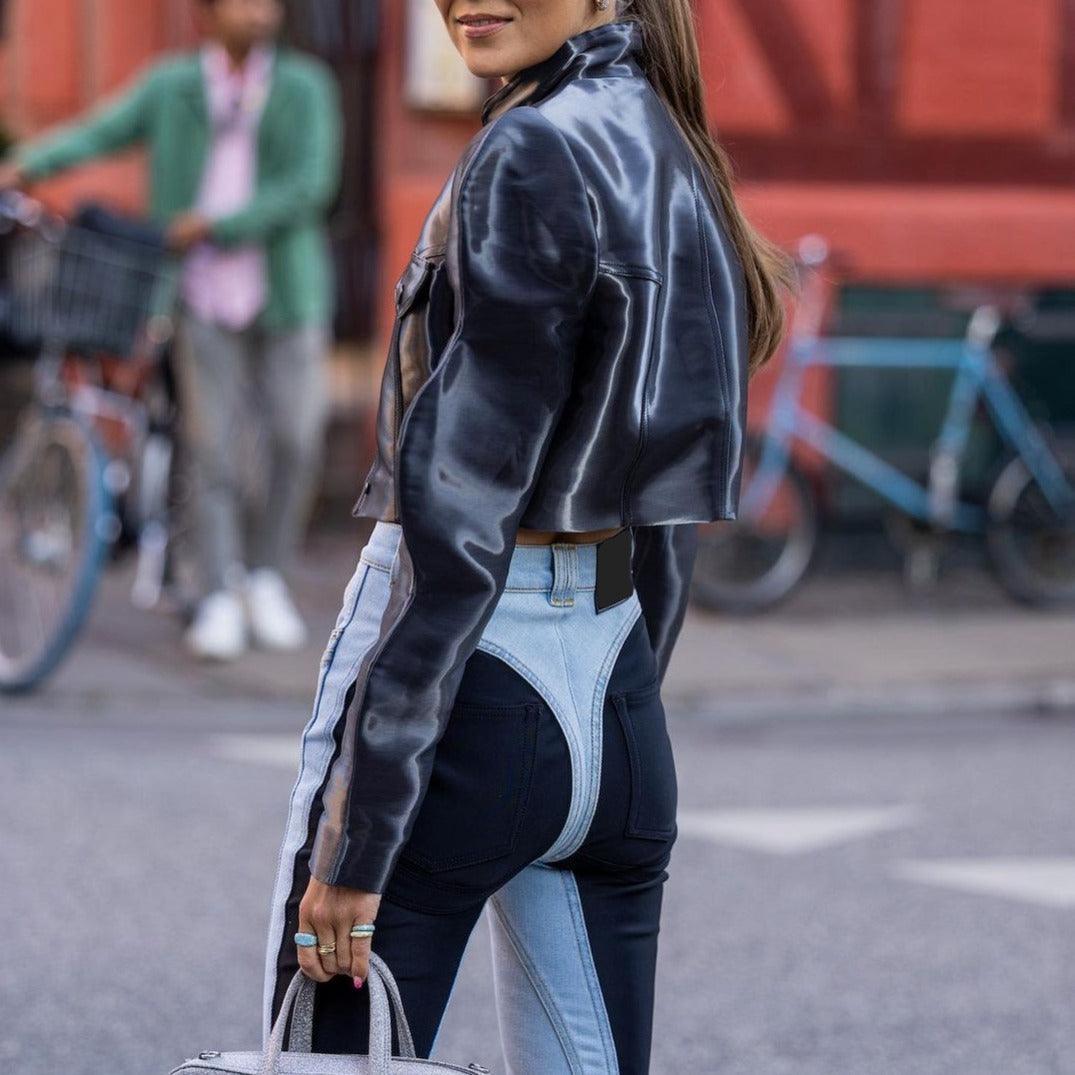 metallic cropped jacket with high-waisted two-tone jeans, street style look