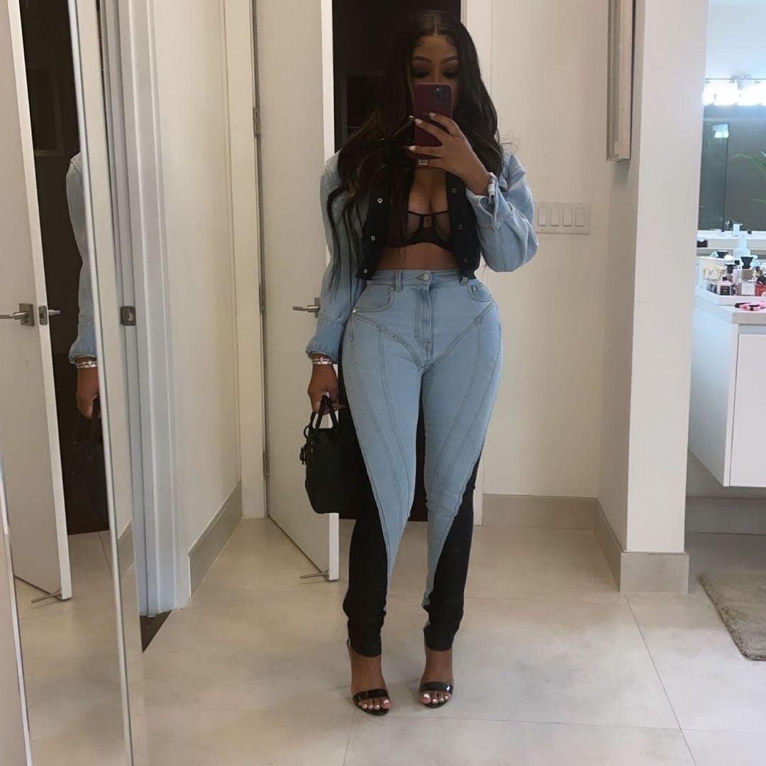 denim two-tone skinny jeans with cropped denim jacket and sheer black bra, casual night-out look