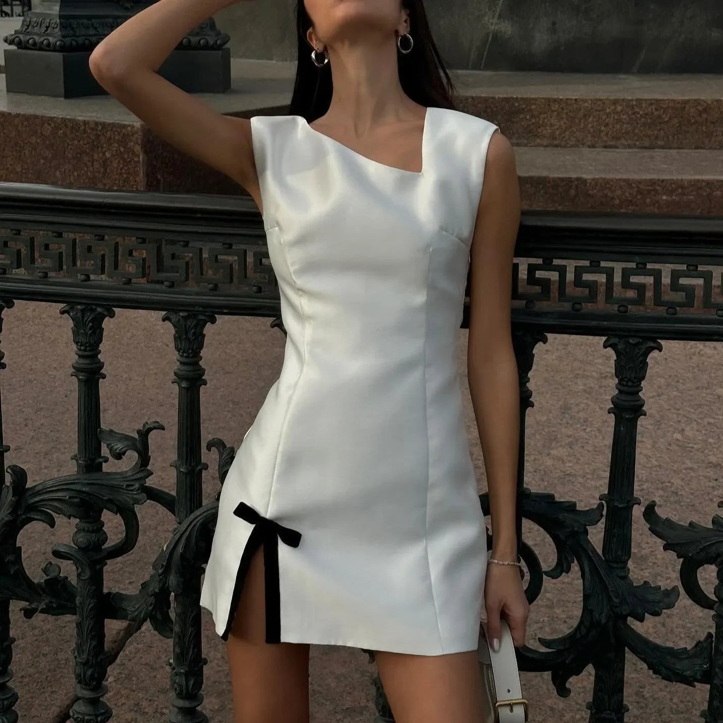 asymmetric satin mini dress with slit and bow detail, evening wear