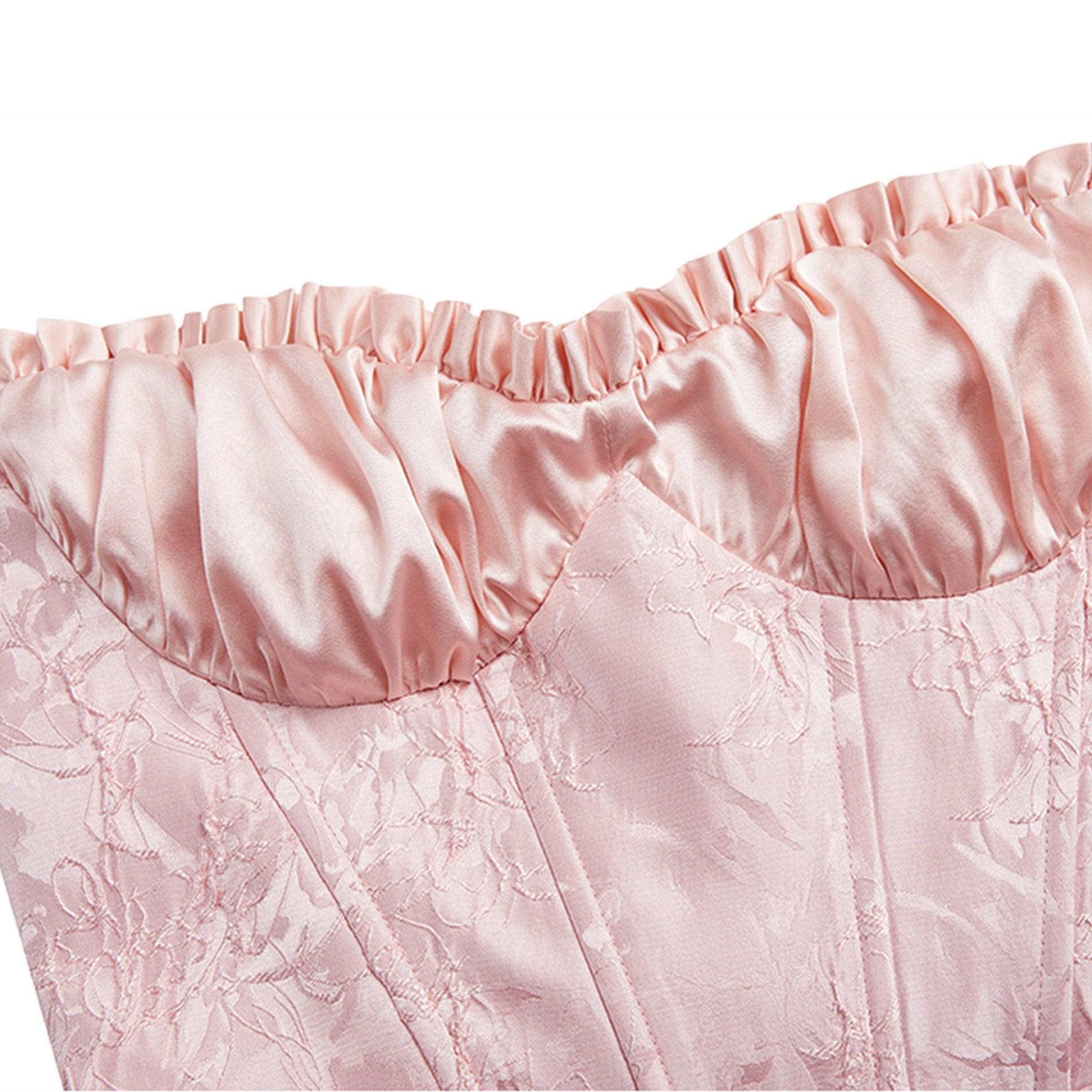 Close-up of pink satin corset dress boning and fabric detail