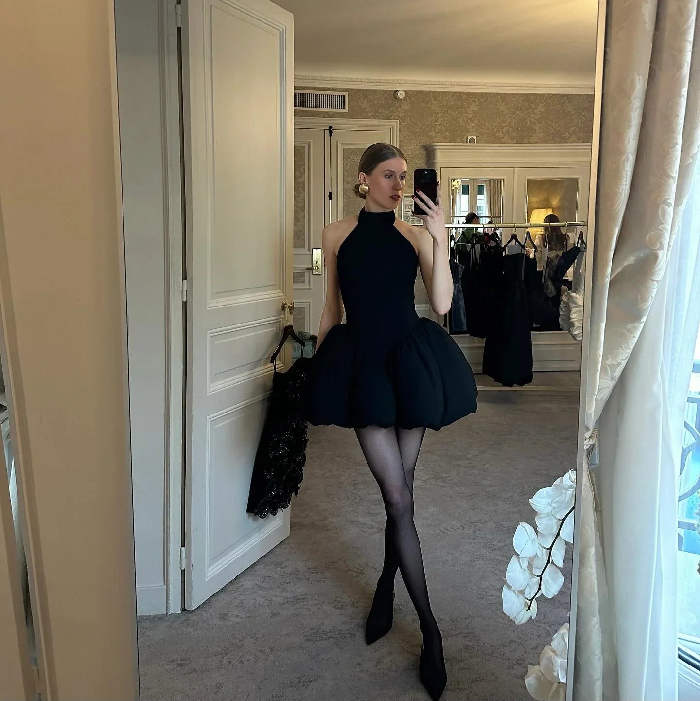 black halter-neck mini dress with voluminous skirt, evening wear