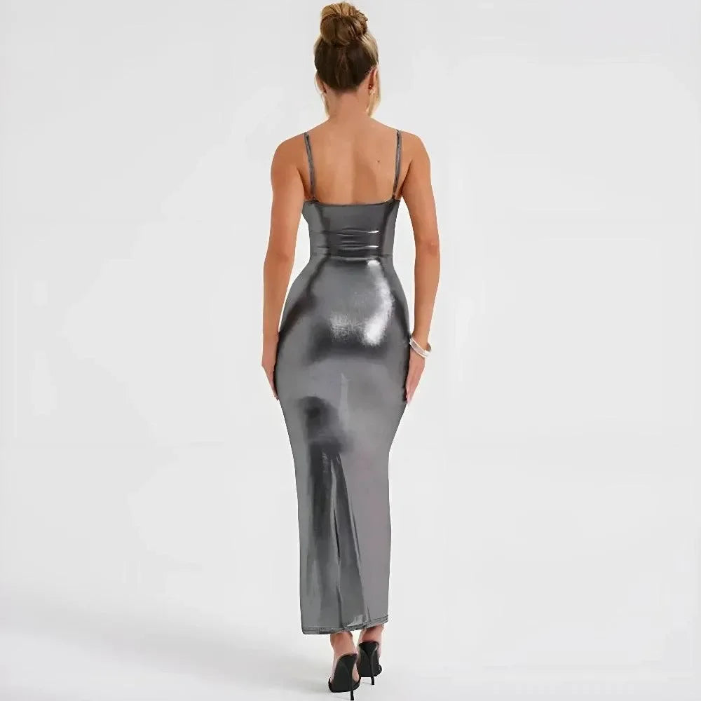 Metallic gray maxi dress with a fitted silhouette, spaghetti straps, and a sleek back design, perfect for evening occasions.