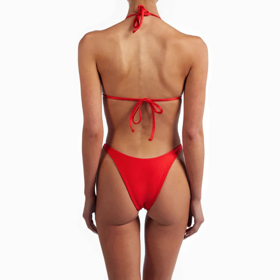 Red floral bikini featuring a halter neck and high-cut bottoms, designed for a flattering fit and playful beach style.