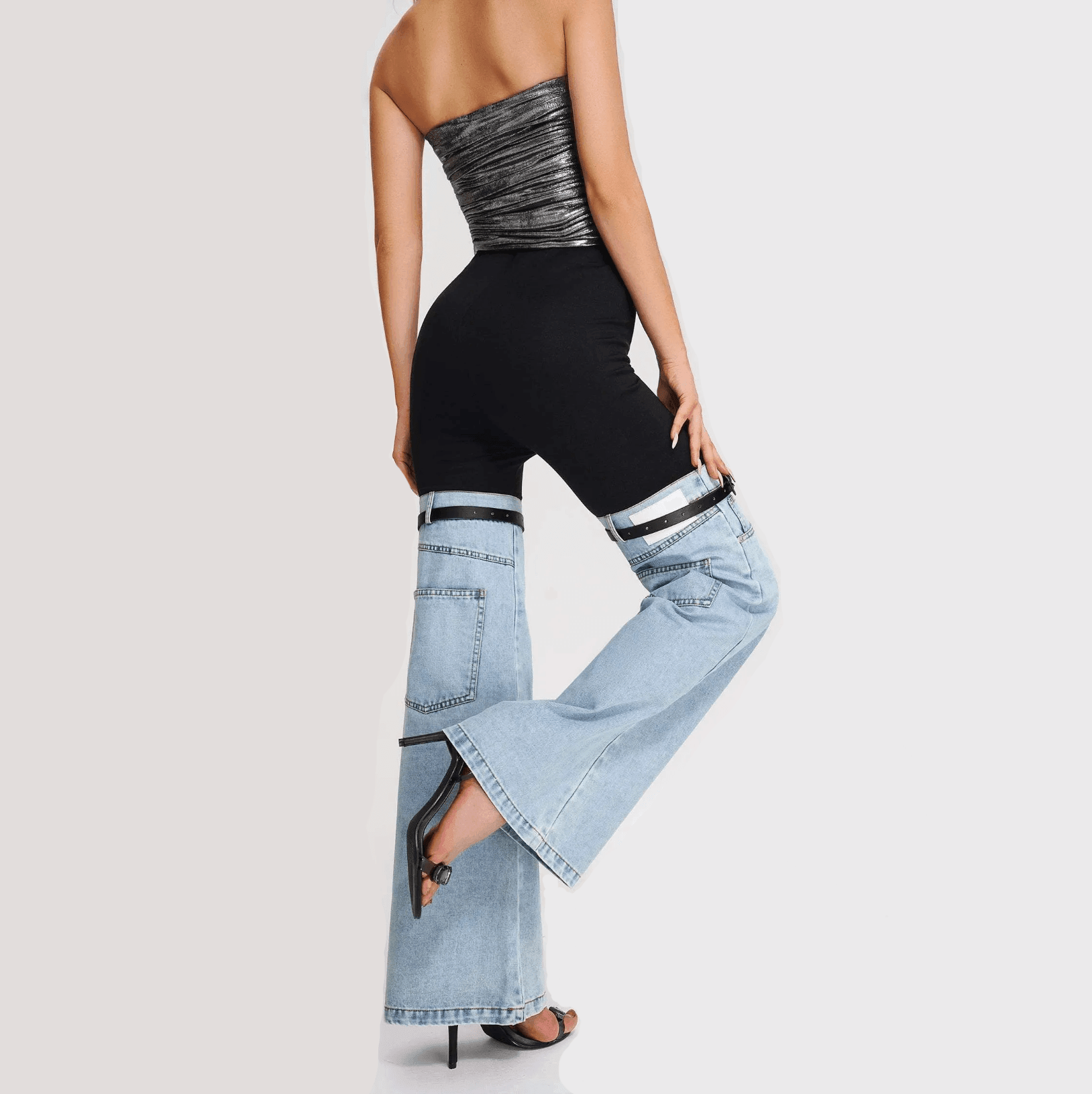 High-waisted denim hybrid flare pants in light blue and black, featuring a sleek fit and flared bottoms, styled with a...