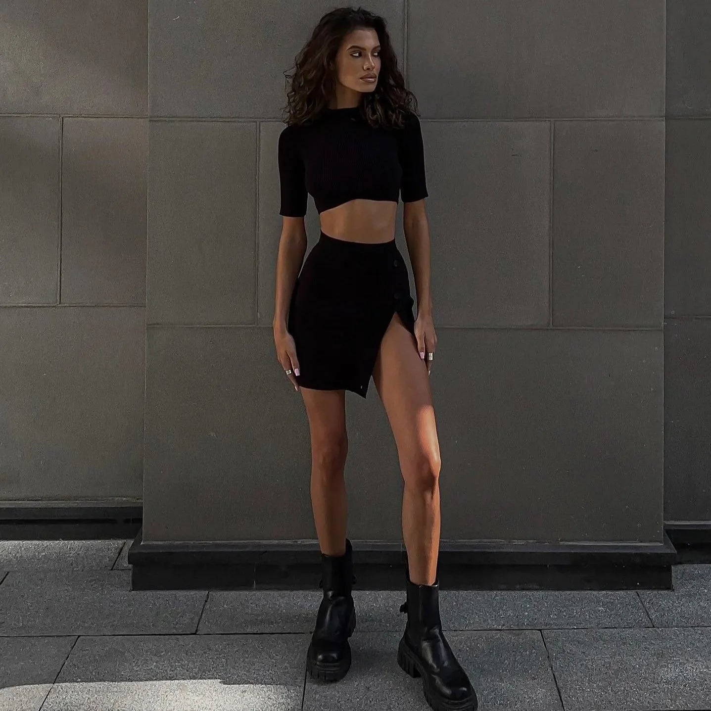 black ribbed co-ord set with crop top and high-slit skirt, edgy street style