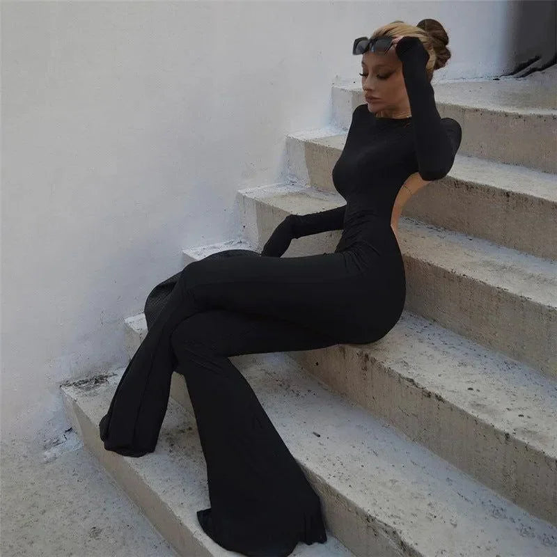 black backless jumpsuit with long sleeves, evening wear