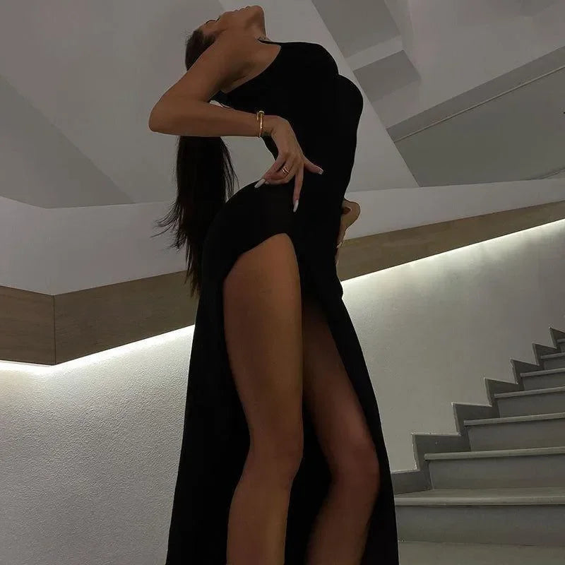 Sleeveless black high-slit maxi dress for evening wear.