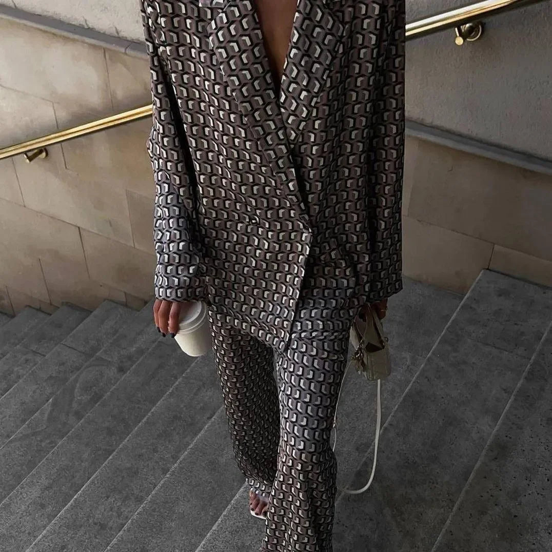 patterned blazer and pants set with a white handbag