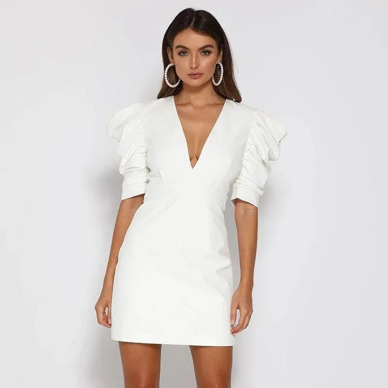white mini dress with puff sleeves and deep V-neck, evening wear