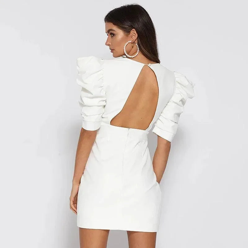 white mini dress with puff sleeves and open back, party outfit