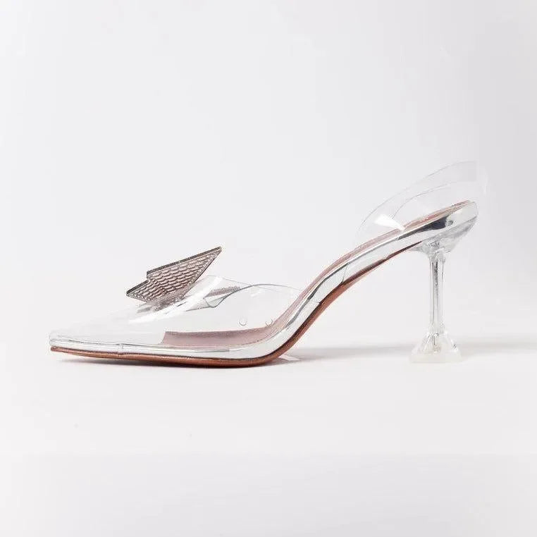 transparent pointed-toe heels with metallic detail, evening wear