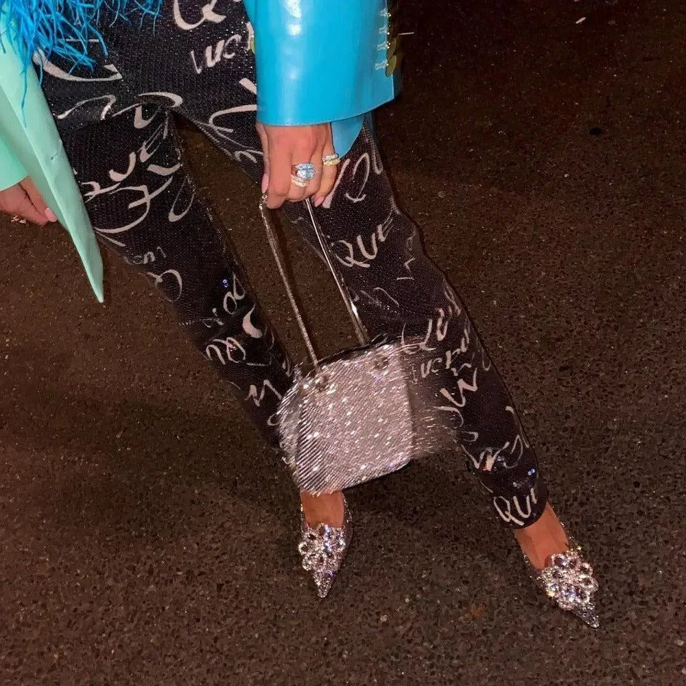 crystal-embellished pointed heels with glitter print pants and rhinestone bag, party outfit