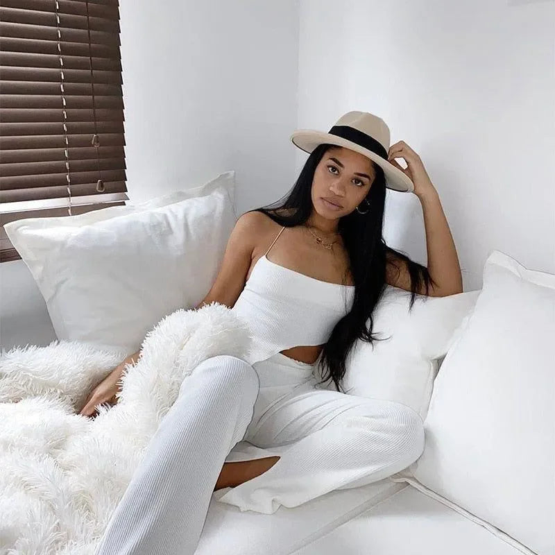 White ribbed co-ord set with spaghetti straps and wide-leg pants.