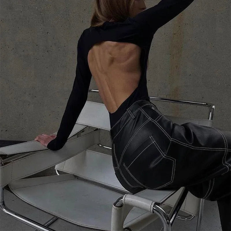 backless black top with leather pants, evening look