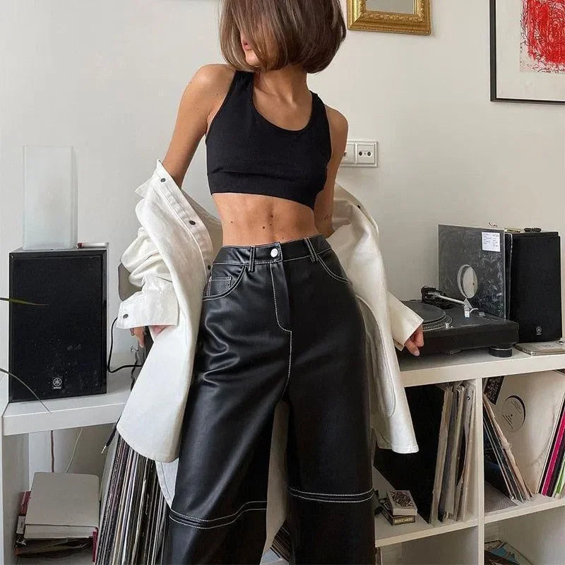 black crop top with high-waisted leather pants, casual look