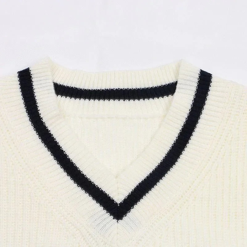 cream V-neck knitted sweater with black trim