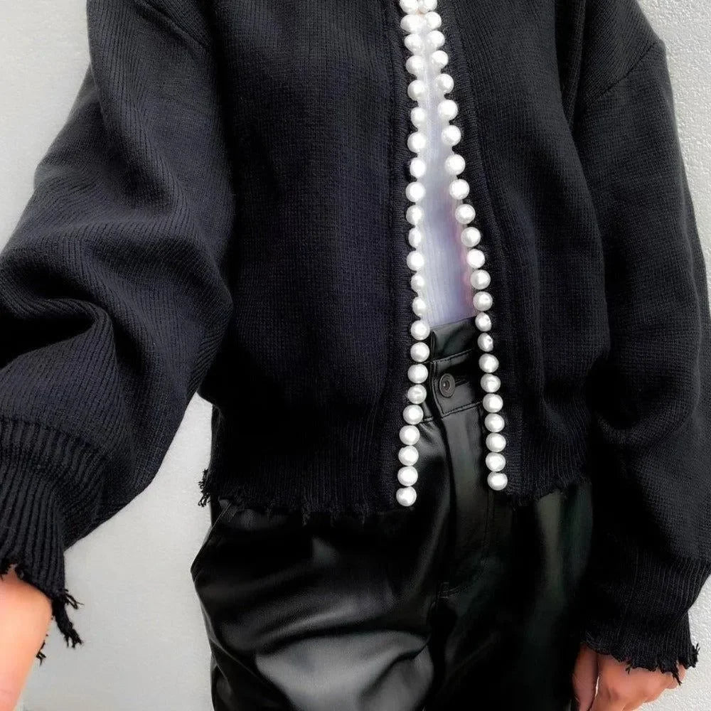 black cardigan with pearl button detailing