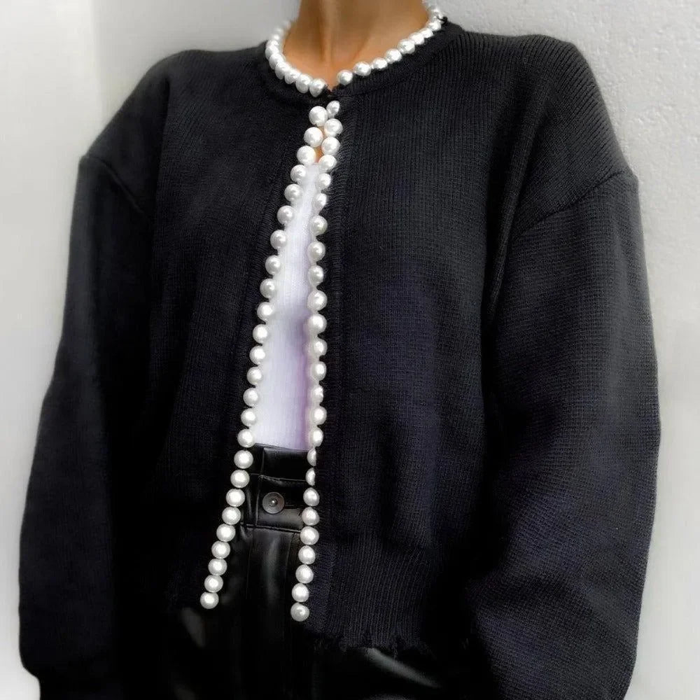 black cardigan with pearl trim, sophisticated look
