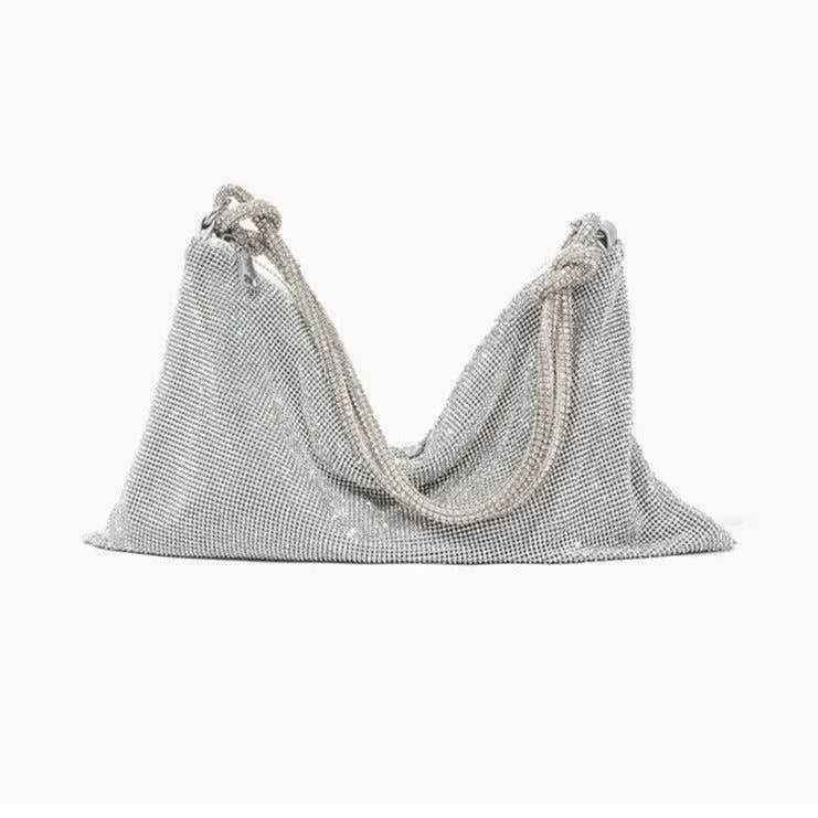 Silver mesh bag with pearl chain for evening events.