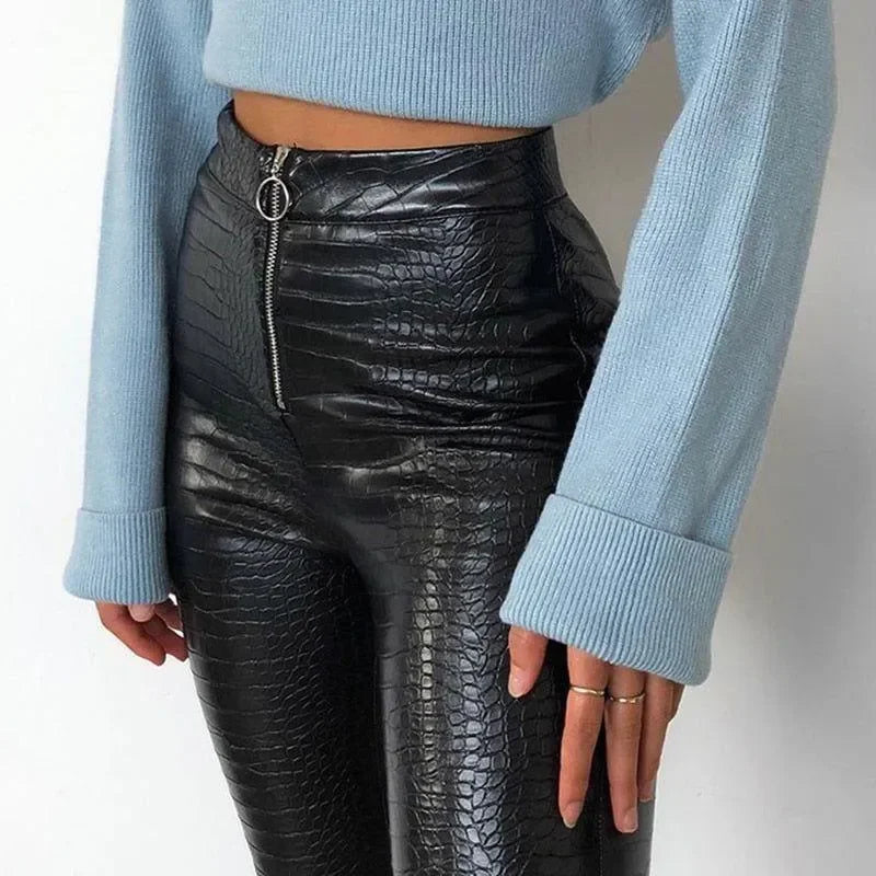 croc-textured high-waisted pants with blue long-sleeve cropped sweater