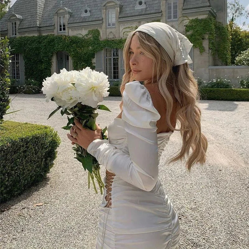 off-shoulder satin ruched dress with lace-up sides, elegant daytime look