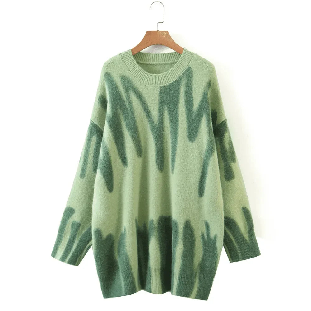 oversized green sweater with abstract pattern