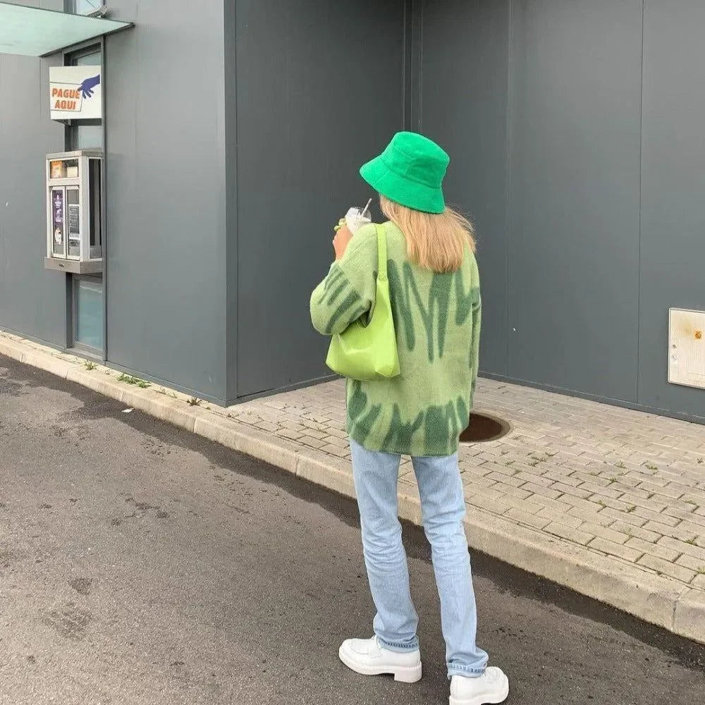 green oversized sweater with abstract pattern, casual day look