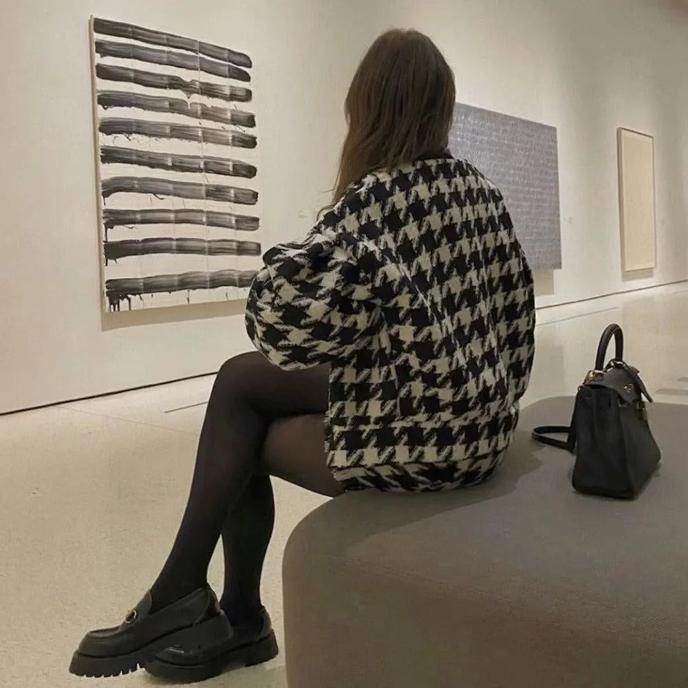 Houndstooth jacket paired with black tights and loafers.